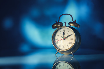 Alarm clock at night in the moonlight