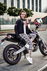 Fototapeta na wymiar Super beautiful girl on a stylish sport motorcycle