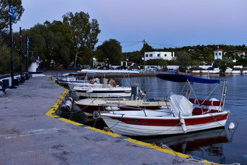 Fototapeta na wymiar Salamina, Greece - August16, 2020: Boats on a small harbor at the historical island of Salamina
