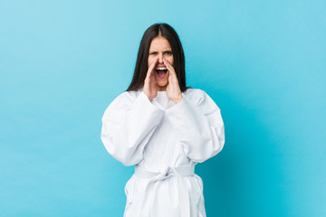 Young karate woman shouting excited to front. © Asier