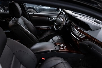 Obraz na płótnie Canvas Car interior with black leather seats. Modern car interior.