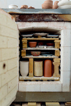 Close-up of ceramics in kiln at workshop