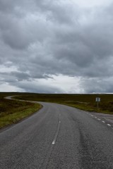 Empty roads in the Highlands Scotlands and the grey clouds
