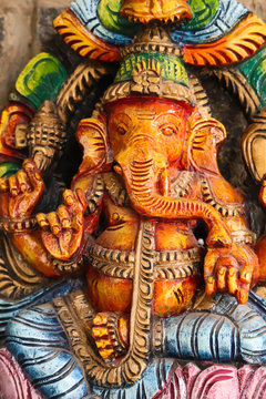 Colorful Painted Handcrafted Statue Of Indian Hindu Lord God Idol Ganesha Ganpati Made Of Earthenware Mud Clay Stone Or Rock For Worship Pooja Puja In Deepawali Deepavali Diwali And Chaturthi Festival