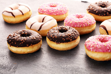 donuts in different glazes frosted with sprinkles