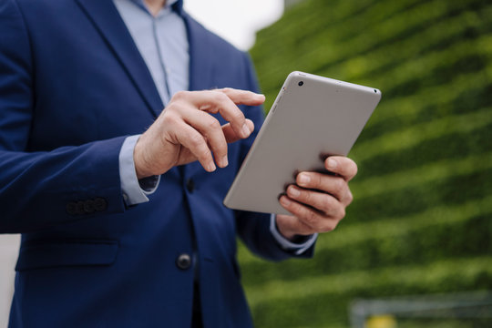 Close-up of businessman using tablet
