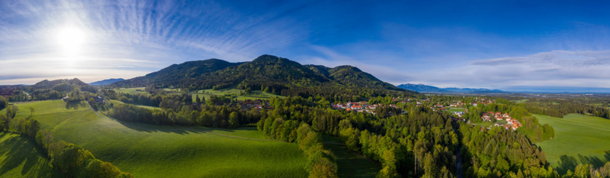 Germany, Bavaria, Bad Heilbrunn, Drone view of green countryside landscape at sunset