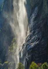 Fototapeta na wymiar A backlit closeup view of Staubbach Falls in Lautbrunnen, Switzerland.