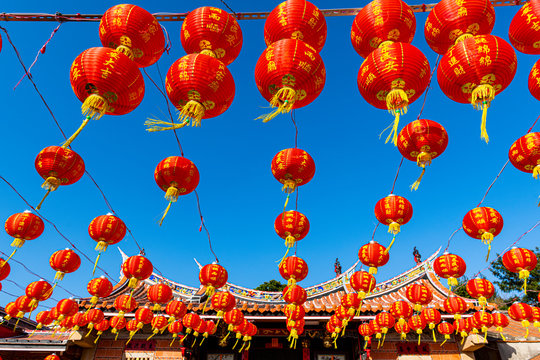 Taiwan, Kinmen, Shuitou Village, Red Chinese lanterns hanging against clear blue sky during Chinese New Year