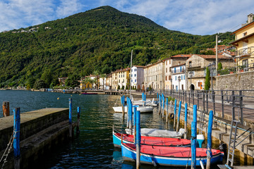 Italy, Lombardy, Riva di Solto, Boat moored on lake Iseo