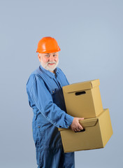 Man with big cardboard box. Bearded man with box. Delivery man with boxes. Shipment. Delivery concept. Delivery from store. Online shopping. Delivery service.