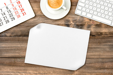 Obraz na płótnie Canvas White paper sheet wooden background Office desk coffee