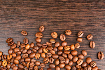 Roasted Coffee beans background. International coffee day concept. Copy space.