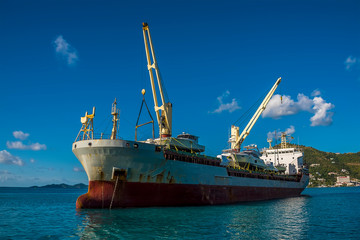 Fototapeta premium A cargo vessel moored of Road Town in Tortola