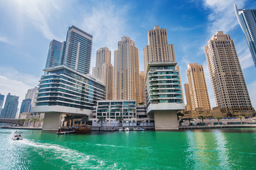 Fototapeta na wymiar Dubai marina water canal with promenade and modern buildings, UAE. Luxury travel concept.