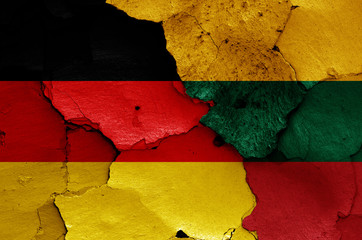 flags of Germany and Lithuania painted on cracked wall