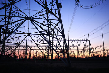 high voltage pylons in the evening