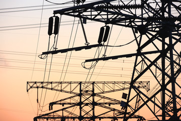 high voltage pylons in the evening