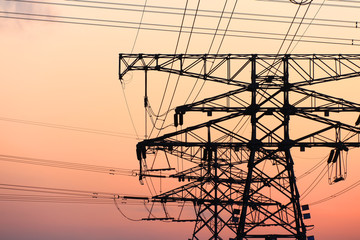 high voltage pylons in the evening