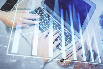Fototapeta premium Multi exposure of woman hands typing on computer and forex chart hologram drawing. Stock market analysis concept.