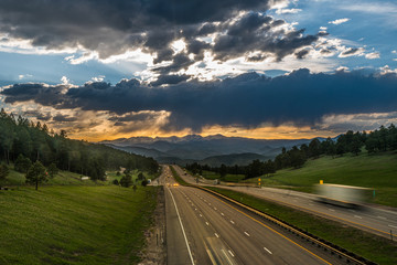 Beautiful Colorado sunset over a busy cloudy road