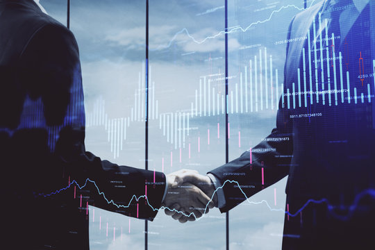 Double exposure of forex graph hologram and handshake of two men. Stock market concept.