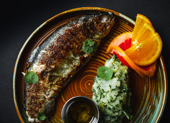 Delicious trout with vegetables as a side dish
