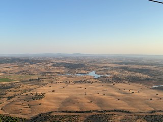 Hot air balloon flight at sunrise, Aerial View over the great Alqueva lake, in Alentejo, Portugal