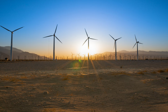 palm springs wind turbines in the desert at sunset