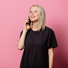 Blonde woman in  black moch-up tshirt and mobile phone