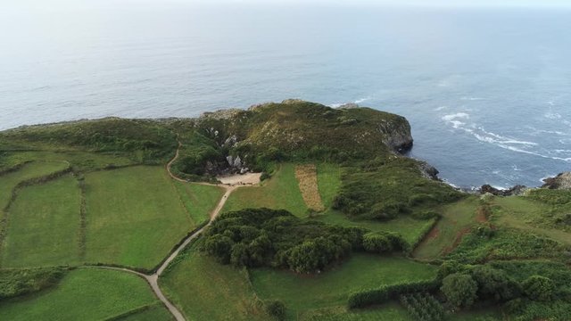 Asturias. Beautiful landscape in the coastal area of Gulpiyuri beach. Spain. Aerial Drone Footage