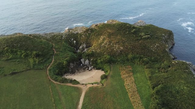 Asturias. Beautiful landscape in the coastal area of Gulpiyuri beach. Spain. Aerial Drone Footage