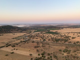 Hot air balloon flight at sunrise, Aerial View over the great Alqueva lake, in Alentejo, Portugal