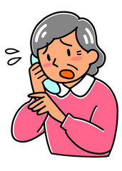 特殊詐欺の電話を受けて動揺する高齢者