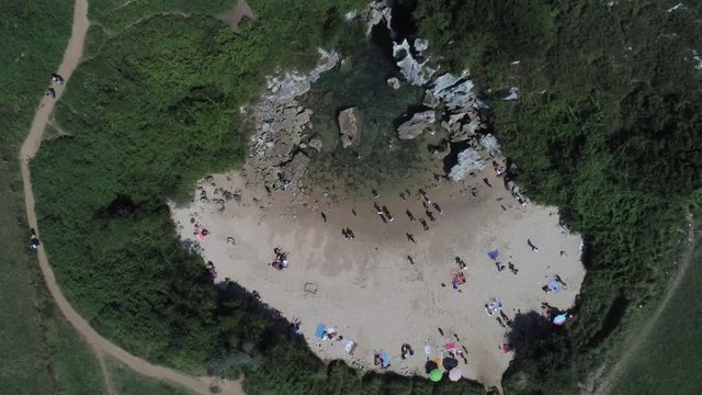 Asturias. Beautiful landscape in the coastal area of Gulpiyuri beach. Spain. Aerial Drone Footage