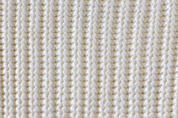 White knitted wool texture background.