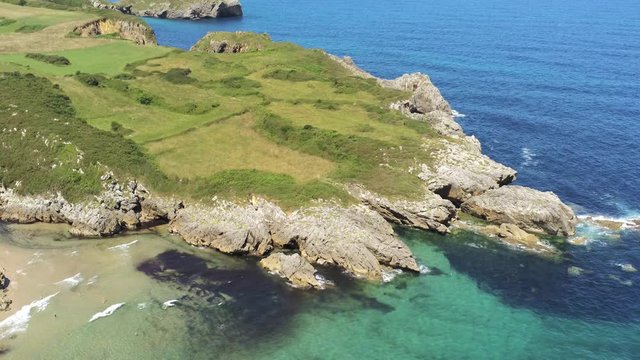 Asturias. Beautiful landscape in the coastal area of Gulpiyuri beach. Spain. Aerial Drone Footage