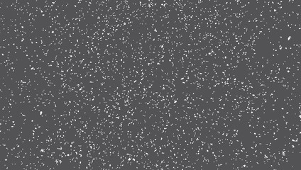 Blacktop surface texture. Small white spots of irregular shape on a dark gray background.