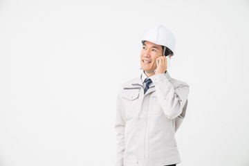 ビジネスマン　作業服　電話