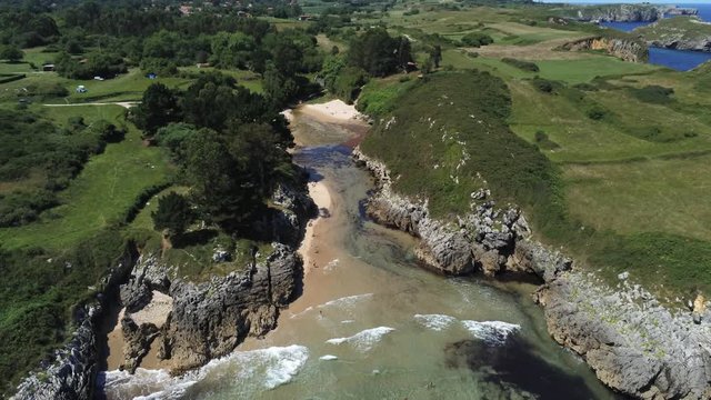 Asturias. Beautiful landscape in the coastal area of Gulpiyuri beach. Spain. Aerial Drone Footage