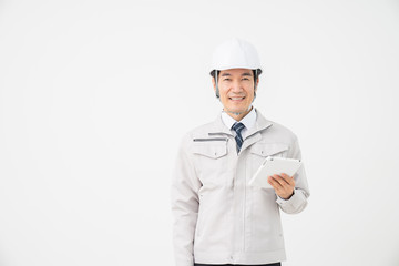 ビジネスマン　作業服　タブレット