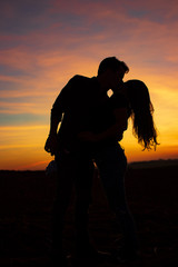 silhouette of a couple on a sunset background