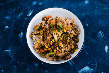 plant-based food, vegan garden vegetables and lentils casserole bake in serving dish