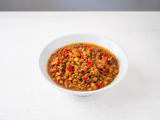 Vegetarian Vegan Indian Food: Lentil Dal Stew Bowl with Vegetables on a White Background