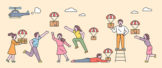 Helicopters are dropping delivery boxes from the air. People are holding parachutes and falling boxes. flat design style minimal vector illustration.