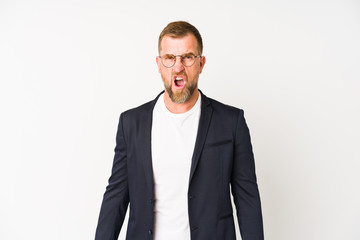 Senior business man isolated on white background screaming very angry and aggressive.