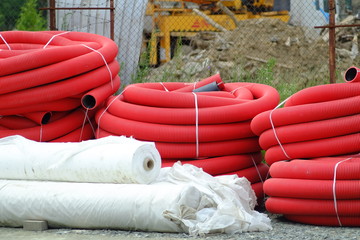 red plastic pipes at construction site