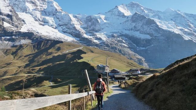 Young Athletic Female Hiker Walking On Trail Near Kleine Scheidegg, Switzerland
