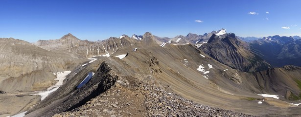 Wide Panoramic Landscape of Rocky Mountain Peaks Hiking Northover Ridge on continental divide between Alberta and British Columbia, Canada