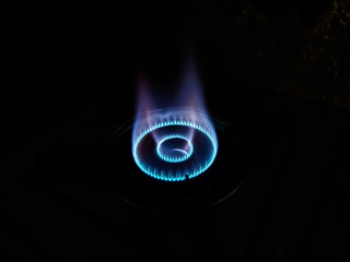 This is the bluish flame of the cooking gas close-up shot in the night.